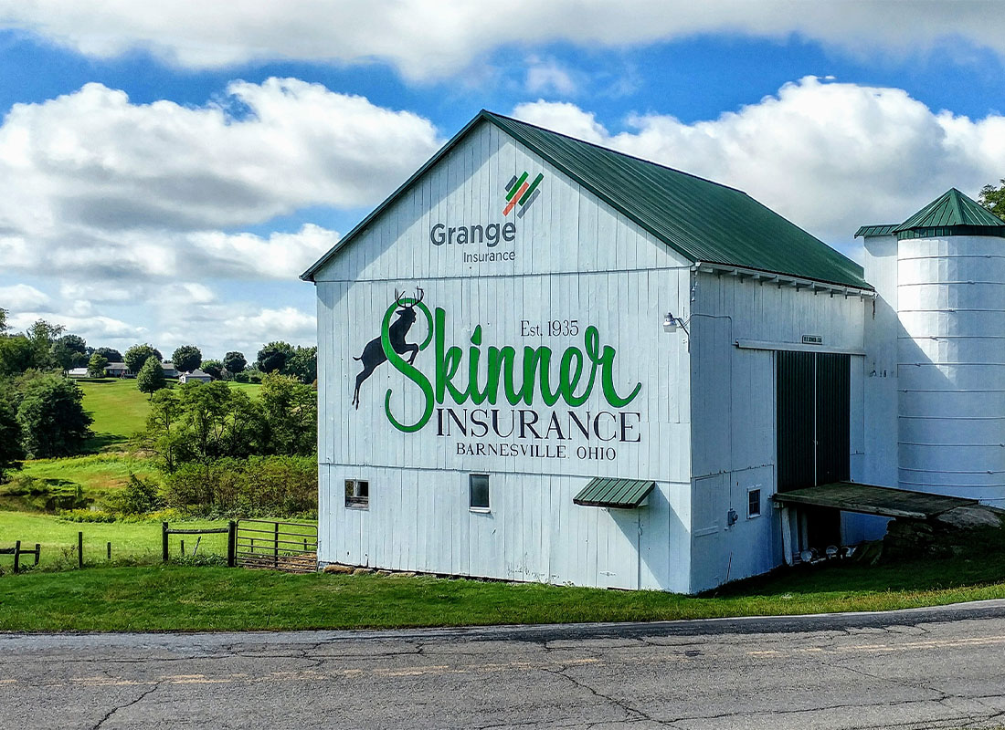 Barnesville, OH - A Shot of a Barn with the W.D. Skinner and Son Insurance Agency and Grange Logo Displayed On It